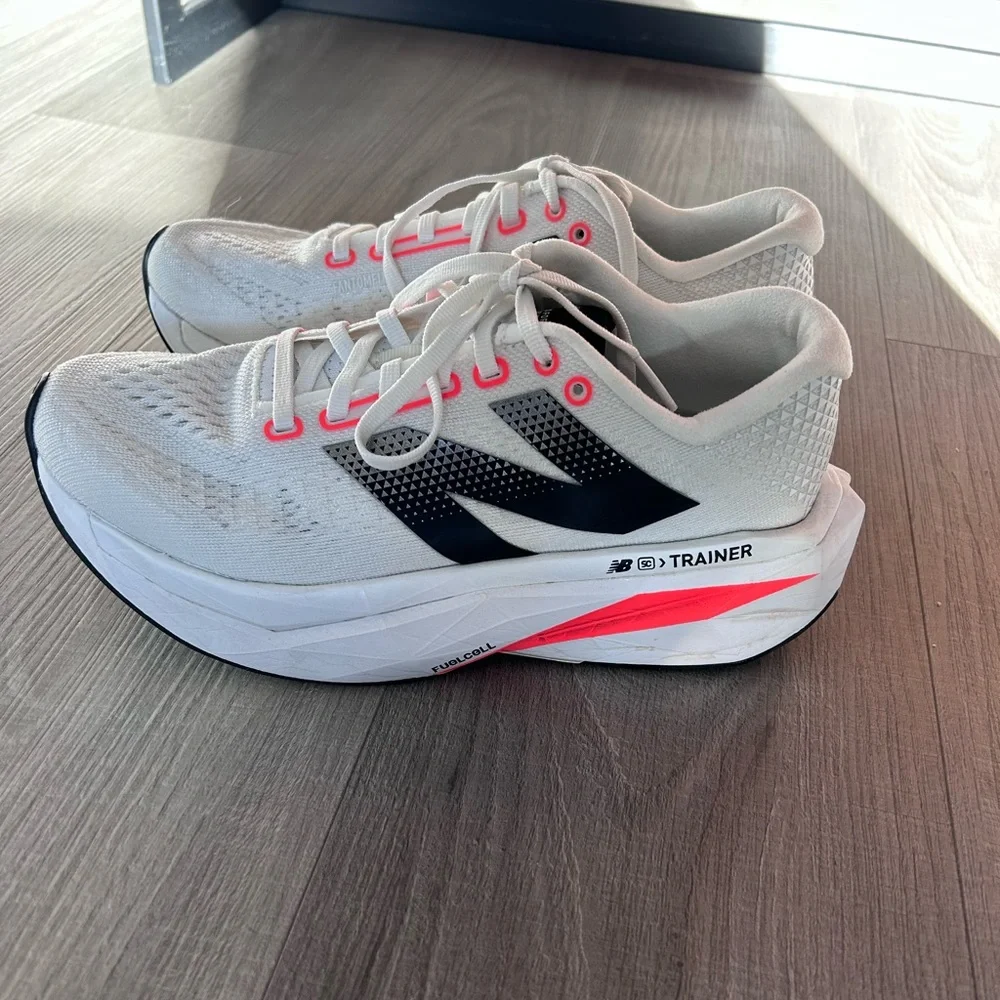 New Balance White Sneakers with Black Logo and Pink Accents